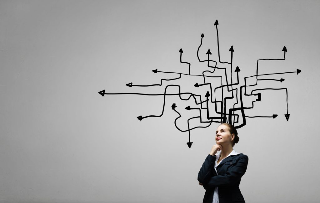 A woman ponders, trying to make the best decision.