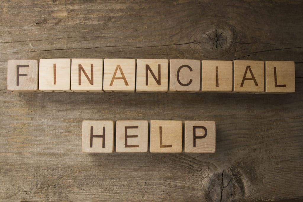 Block letters spelling out ‘financial help.’