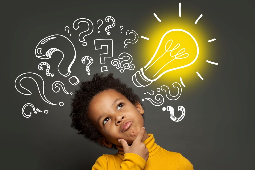 A thinking student stands against a dark background, with a doodle of a lightbulb going off above his head.