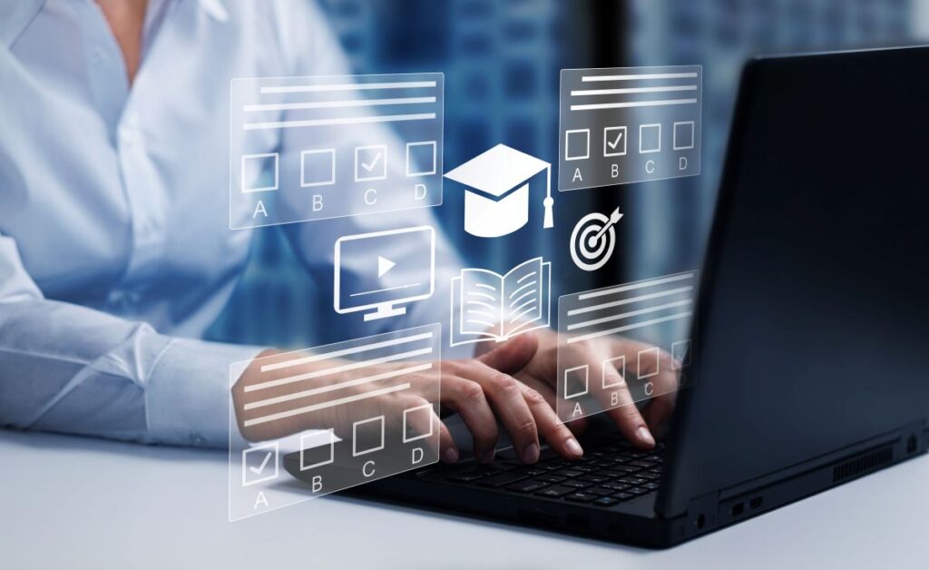A teacher sits on her computer looking through some educational apps.