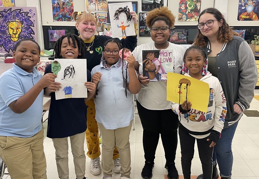 Point Park University students pose for a photo with Pittsburgh Faison students after facilitating a mini-lesson based on the book "Hair Love," by Matthew A. Cherry.