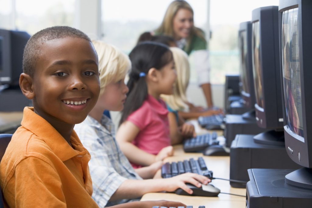 Group of kids in a school computer lab.